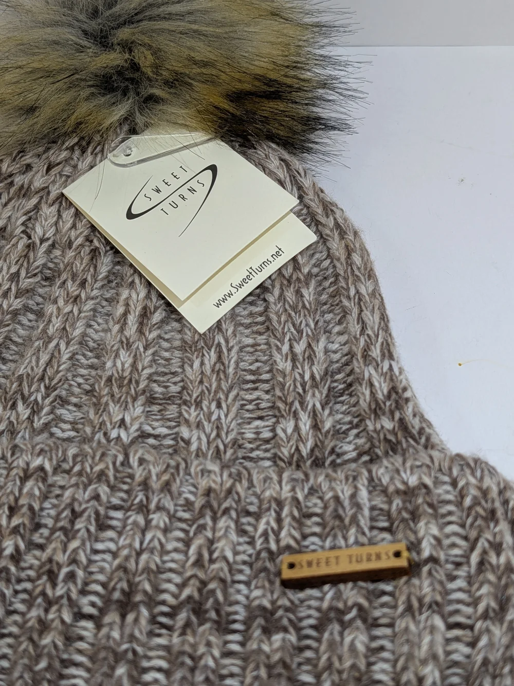 Sweet Turns knit pompom fleece lined beanie hat